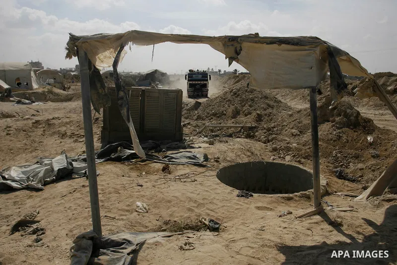 Palestinians work at smuggling tunnels along the border with Egypt in Rafah, southern Gaza Strip, on Oct. 04, 2012. Since last month, Egyptian military have destroyed about 30 tunnels and blocked more which were used for...