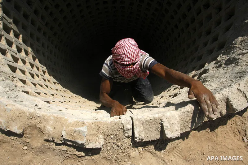 A Palestinian man ascend a tunnel along the Gaza-Egypt border in Rafah, in the southern Gaza Strip on Oct. 04, 2012. Since last month, Egyptian military have destroyed about 30 tunnels and blocked more which were used fo...