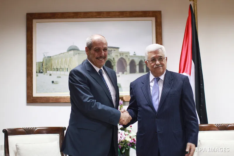 Palestinian President Mahmoud Abbas Shake hands with Jordanian Prime Minister Fayez Al Tarawneh (L) during their meeting in the West Bank city of Ramallah on Oct. 4, 2012. Photo by Fadi Arouri-POOL