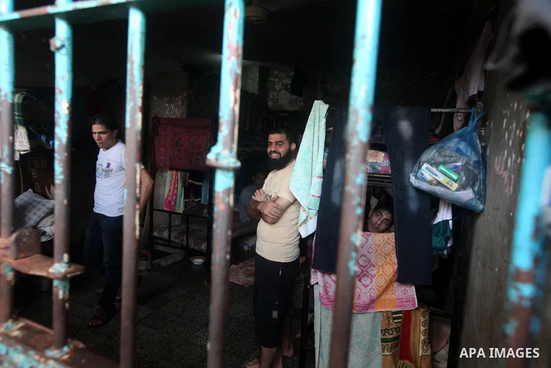 Palestinian prisoners sit in their cell in the Hamas-run Ansar prison in Gaza City on October 4, 2012. The jail holds prisoners convicted of all types of offenses. Human Rights Watch accused Gaza's ruling Hamas movement...