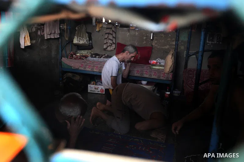 Palestinian prisoners sit in their cell in the Hamas-run Ansar prison in Gaza City on October 4, 2012. The jail holds prisoners convicted of all types of offenses. Human Rights Watch accused Gaza's ruling Hamas movement...