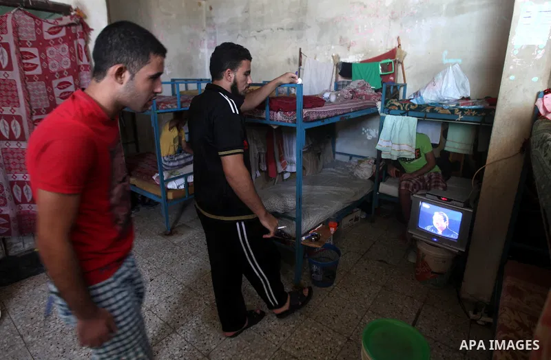 Palestinian prisoners watche TV in a cell in the Hamas-run Ansar prison in Gaza City on October 4, 2012. The jail holds prisoners convicted of all types of offenses. Human Rights Watch accused Gaza's ruling Hamas movemen...