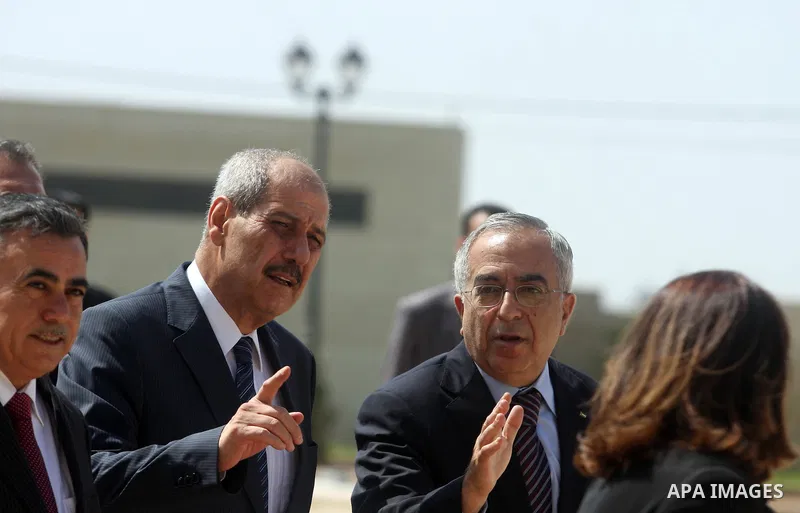 Palestinian Prime Minister Salam Fayyad, and Jordanian Prime Minister Fayez Al Tarawneh arrive at Palestinian President Mahmoud Abbas headquarters in the West Bank city of Ramallah, Oct. 4, 2012. Photo by Issam Rimawi