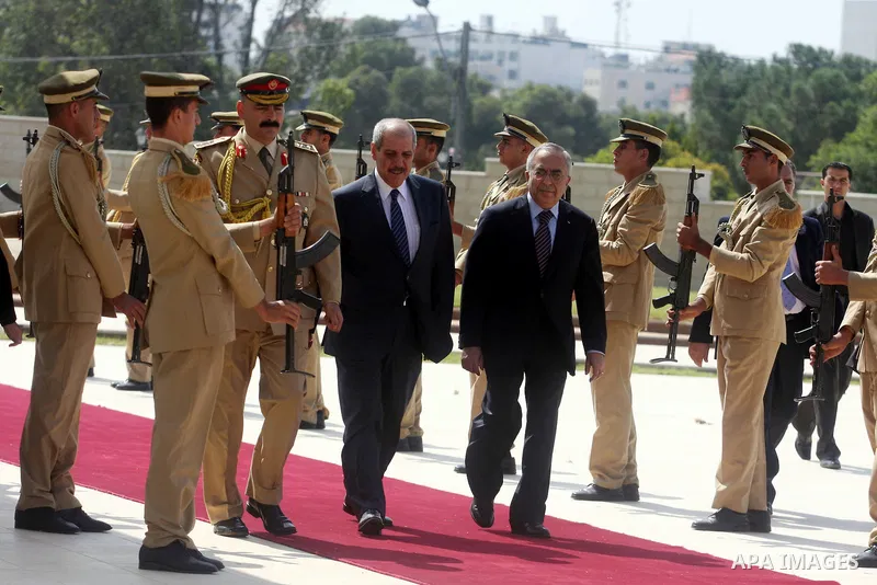 Palestinian Prime Minister Salam Fayyad, and Jordanian Prime Minister Fayez Al Tarawneh arrive at Palestinian President Mahmoud Abbas headquarters in the West Bank city of Ramallah, Oct. 4, 2012. Photo by Issam Rimawi
