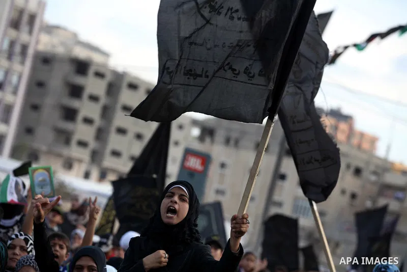 Female Islamic Jihad militants take part in a ceremony marking the 25th anniversary of the movement's establishment and the 17th anniversary of the death of the group's leader Fathi Shekaki in Gaza City October 4, 2012....