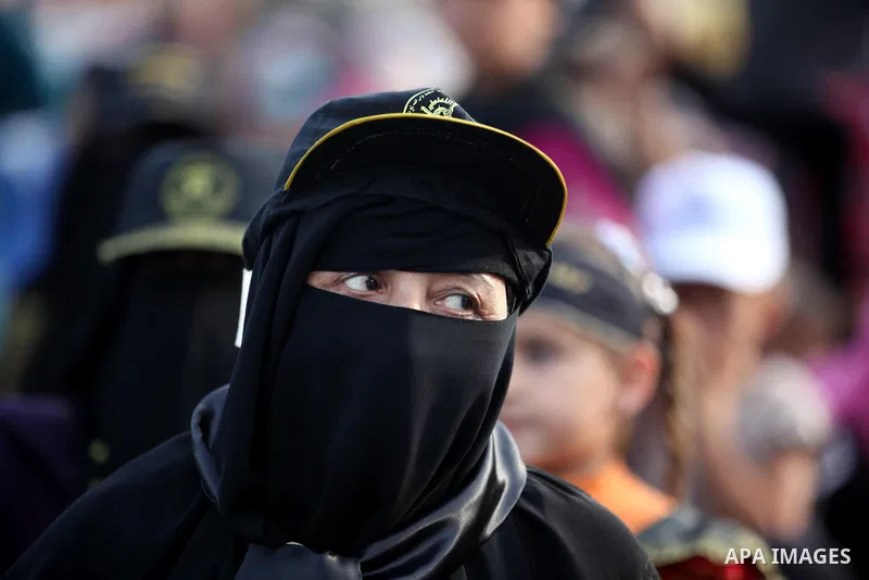 A female Islamic Jihad militants takes part in a ceremony marking the 25th anniversary of the movement's establishment and the 17th anniversary of the death of the group's leader Fathi Shekaki in Gaza City October 4, 201...