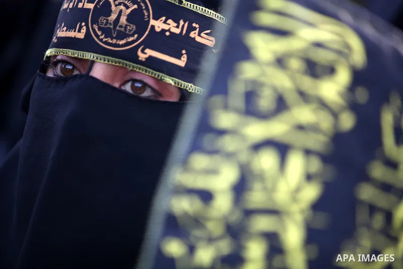 A female Islamic Jihad militants takes part in a ceremony marking the 25th anniversary of the movement's establishment and the 17th anniversary of the death of the group's leader Fathi Shekaki in Gaza City October 4, 201...