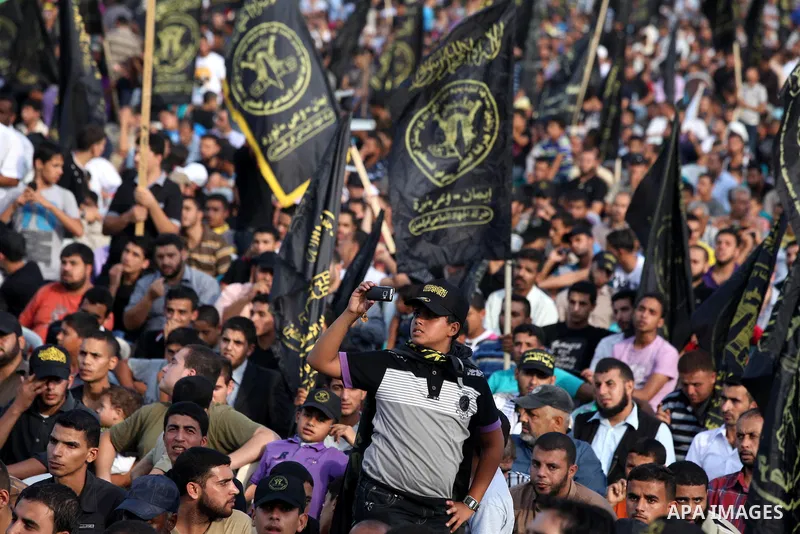 Palestinian supporters of Islamic Jihad movement take part in a ceremony marking the 25th anniversary of the movement's establishment and the 17th anniversary of the death of the group's leader Fathi Shekaki in Gaza City...