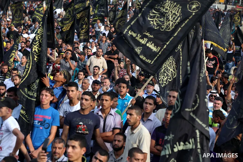 Palestinian supporters of Islamic Jihad movement take part in a ceremony marking the 25th anniversary of the movement's establishment and the 17th anniversary of the death of the group's leader Fathi Shekaki in Gaza City...