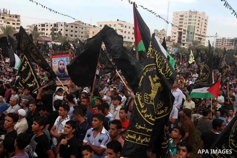 Palestinian supporters of Islamic Jihad movement take part in a ceremony marking the 25th anniversary of the movement's establishment and the 17th anniversary of the death of the group's leader Fathi Shekaki in Gaza City...