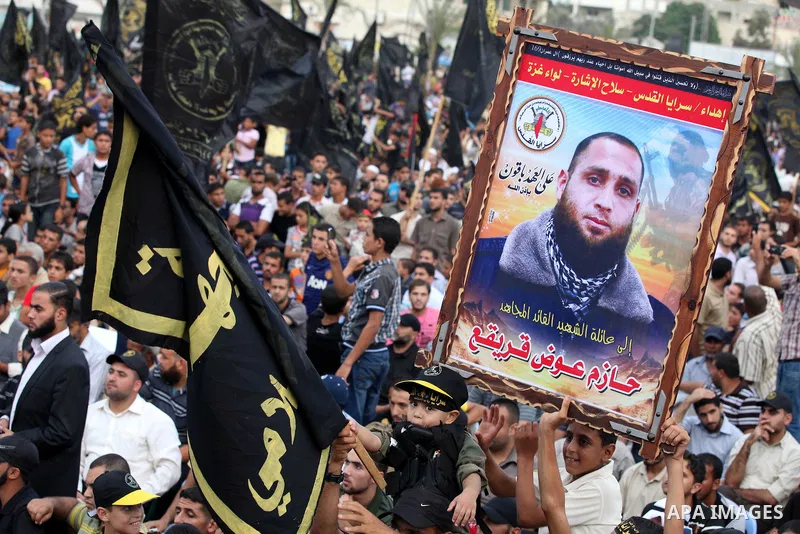 Palestinian supporters of Islamic Jihad movement take part in a ceremony marking the 25th anniversary of the movement's establishment and the 17th anniversary of the death of the group's leader Fathi Shekaki in Gaza City...