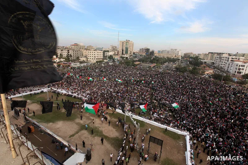 Palestinian supporters of Islamic Jihad movement take part in a ceremony marking the 25th anniversary of the movement's establishment and the 17th anniversary of the death of the group's leader Fathi Shekaki in Gaza City...