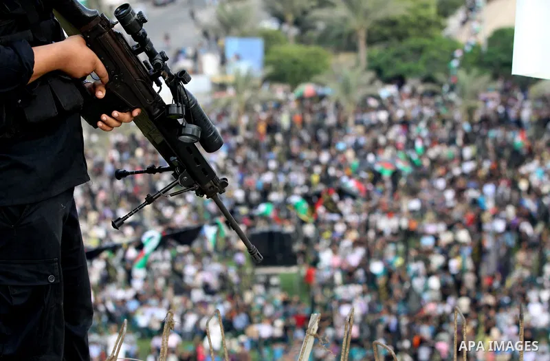 An Islamic Jihad militant stands guard during a ceremony marking the 25th anniversary of the movement's foundation and the 17th anniversary of the death of the group's leader Fathi Shekaki in Gaza City October 4, 2012. P...