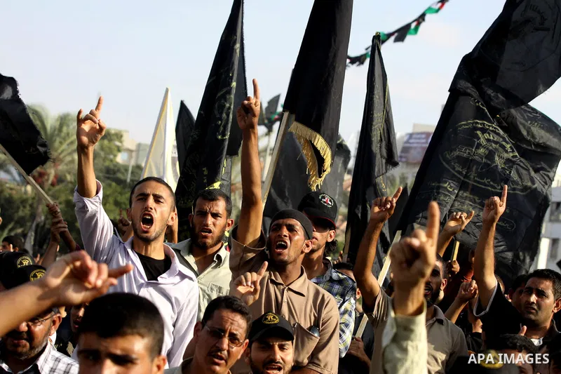 Palestinian supporters of Islamic Jihad movement take part in a ceremony marking the 25th anniversary of the movement's foundation and the 17th anniversary of the death of the group's leader Fathi Shekaki in Gaza City Oc...