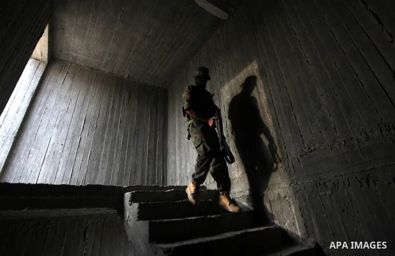 An Islamic Jihad militant guards during a ceremony marking the 25th anniversary of the movement's foundation and the 17th anniversary of the death of the group's leader Fathi Shekaki in Gaza City October 4, 2012. Photo b...