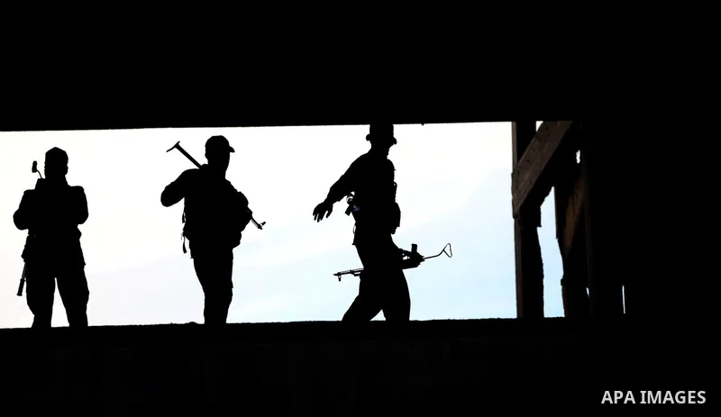 Islamic Jihad militants stand guard during a ceremony marking the 25th anniversary of the movement's foundation and the 17th anniversary of the death of the group's leader Fathi Shekaki in Gaza City October 4, 2012. Phot...