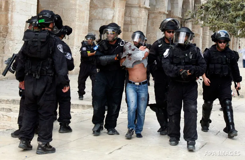 Israeli riot police detain a Palestinian worshipper during clashes at the Al Aqsa Mosque compound, known by the Jews as the Temple Mount, in Jerusalem's Old City, Friday, Oct. 5, 2012. Earlier this week, hardline Jewish...