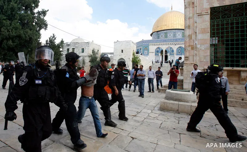 Israeli riot police detain a Palestinian worshipper during clashes at the Al Aqsa Mosque compound, known by the Jews as the Temple Mount, in Jerusalem's Old City, Friday, Oct. 5, 2012. Earlier this week, hardline Jewish...