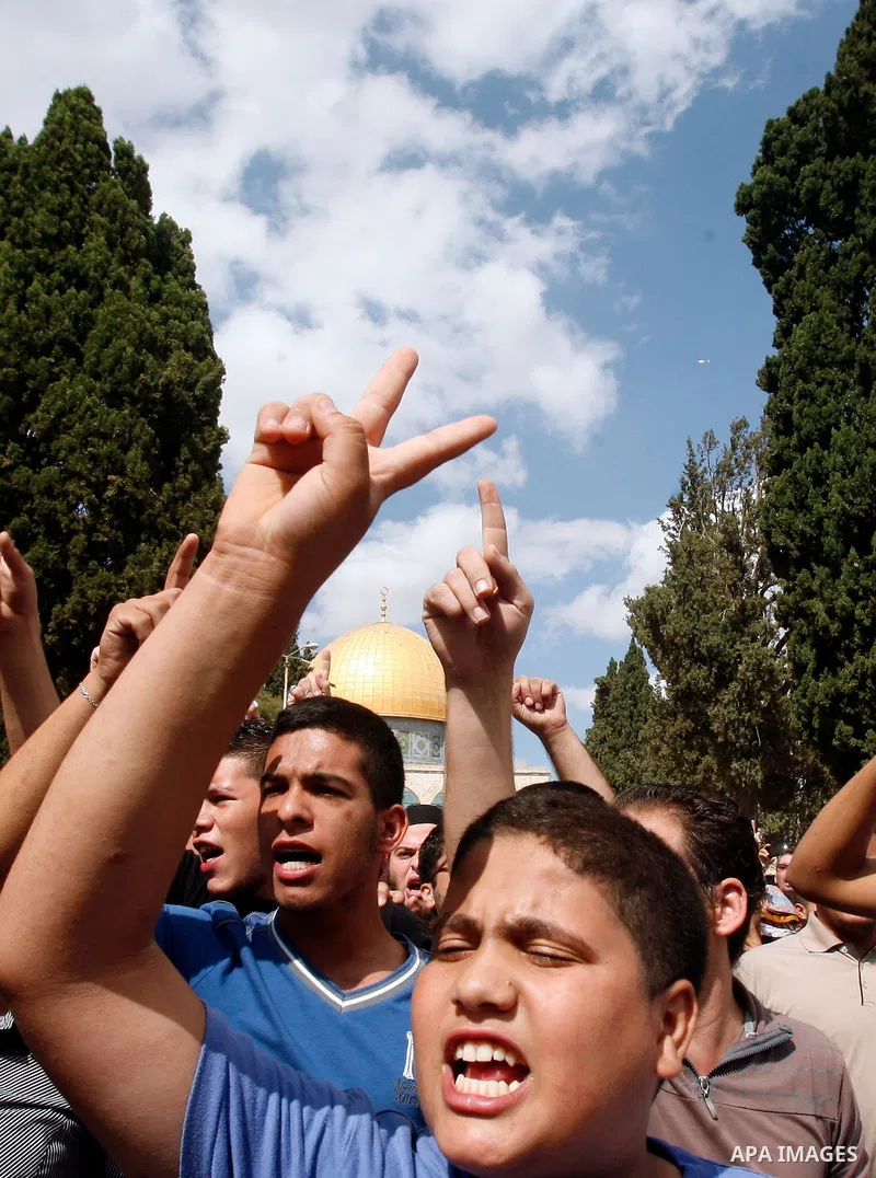 Palestinian worshippers shout slogans during a demonstration at the Al Aqsa Mosque compound, known by the Jews as the Temple Mount, in Jerusalem's Old City, Friday, Oct. 5, 2012. Earlier this week, hardline Jewish activi...