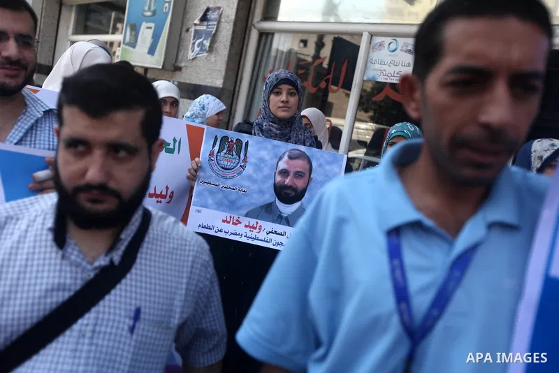 Palestinian journalists attend a protest against arrests of the journalists by the security forces in the West Bank, Gaza City on Oct. 06, 2012. Photo by Majdi Fathi
