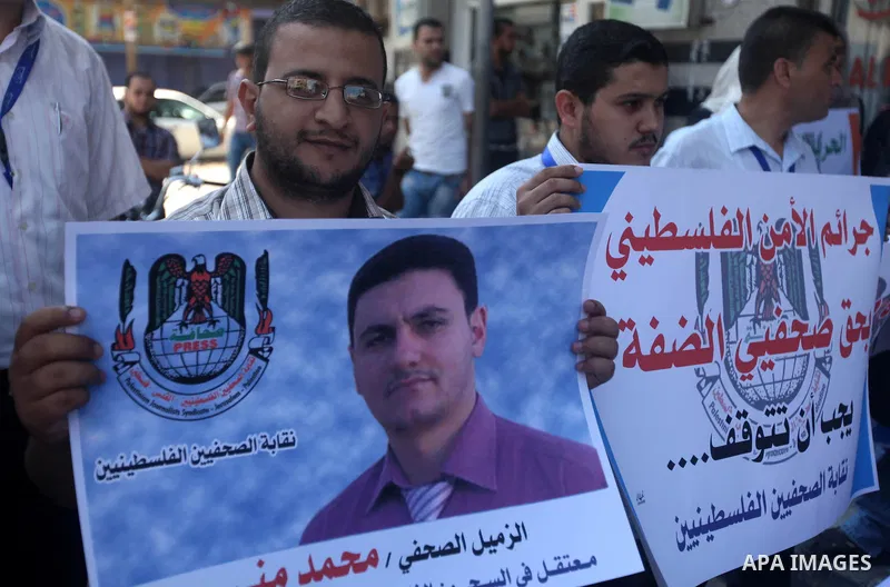 Palestinian journalists attend a protest against arrests of the journalists by the security forces in the West Bank, Gaza City on Oct. 06, 2012. Photo by Majdi Fathi