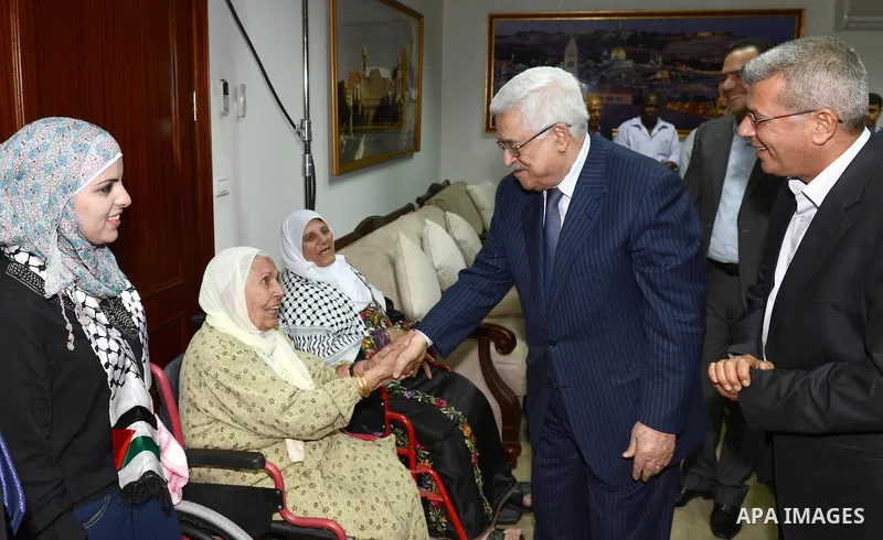 Palestinian President Mahmoud Abbas meet with a number of families of prisoners veterans in the West Bank city of Ramallah, October 6, 2012. Photo by Mohamed al-Ateeq