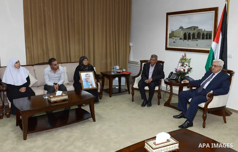 Palestinian President Mahmoud Abbas meet with a number of families of prisoners veterans in the West Bank city of Ramallah, October 6, 2012. Photo by Mohamed al-Ateeq