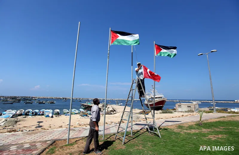 Palestinian laborers work at Gaza seaport during the preparation to receive the ship Estelle which coming from naples, in Gaza city on October 07, 2012. The Estelle, the latest ship to try to break Israel's blockade on G...