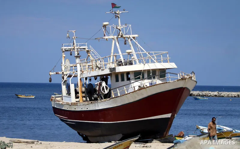 Palestinian laborers work at Gaza seaport during the preparation to receive the ship Estelle which coming from naples, in Gaza city on October 07, 2012. The Estelle, the latest ship to try to break Israel's blockade on G...