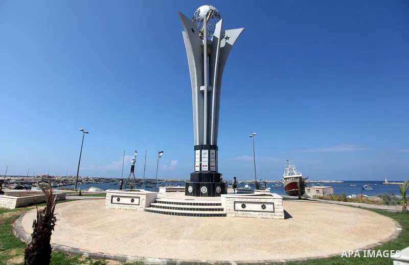 Palestinian laborers work at Gaza seaport during the preparation to receive the ship Estelle which coming from naples, in Gaza city on October 07, 2012. The Estelle, the latest ship to try to break Israel's blockade on G...