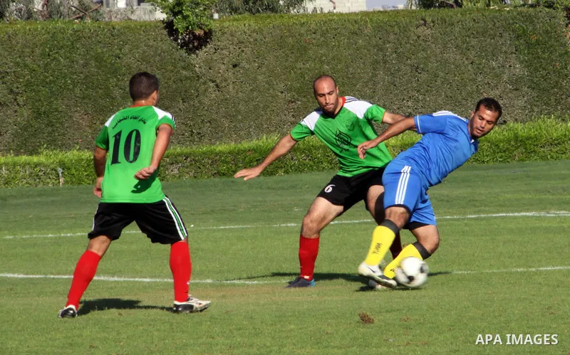 Palestinian soccer team of Shijaia and the team of Nusseirat services play during the 4th round in the premier league in Gaza city on Oct. 07 2012. Photo by Alaa Shamaly