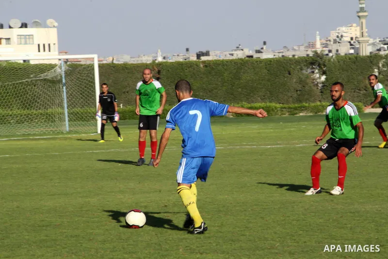 Palestinian soccer team of Shijaia and the team of Nusseirat services play during the 4th round in the premier league in Gaza city on Oct. 07 2012. Photo by Alaa Shamaly