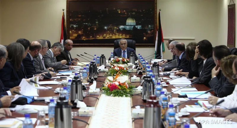 Palestinian Prime Minister Salam Fayyad meets with members of the Palestinian government, in the West Bank city of Ramallah, on Oct. 09, 2012. Photo by Mustafa Abu Dayah