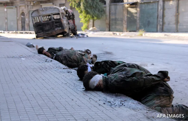 An Image shows the bodies of Syrian soldiers who the Syrian Observatory for Human Rights said were executed by FSA in the Hanano district of the northern city of Aleppo on 16 September 2012. FSA have summarily executed a...