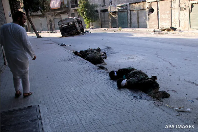 An Image shows the bodies of Syrian soldiers who the Syrian Observatory for Human Rights said were executed by FSA in the Hanano district of the northern city of Aleppo on 16 September 2012. FSA have summarily executed a...