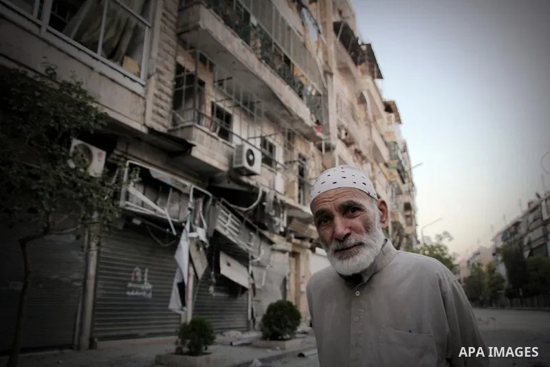 Syrians inspect damages in the old city of Aleppo after the area was shelled by Syrian regime forces on September 08 2012. Forces loyal to President Bashar al-Assad shelled rebel-held areas across Syria as fierce clashes...