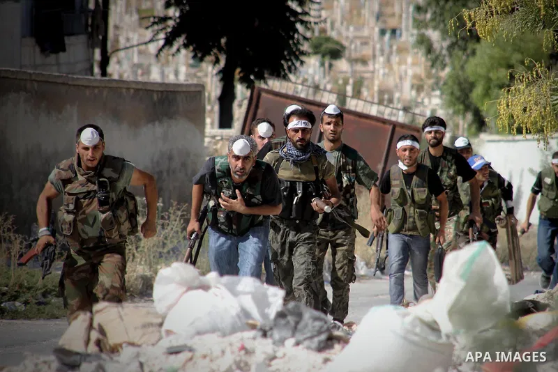 Free Syrian Army take position during heavy clashes with Syrian government forces , in the Old Town of Aleppo, September 07, 2012, to retake control of the large Hanano army base in Aleppo. Photo by Ahmed Deeb