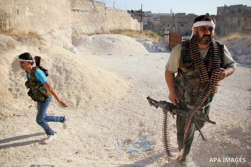 Free Syrian Army take position during heavy clashes with Syrian government forces , in the Old Town of Aleppo, September 07, 2012, to retake control of the large Hanano army base in Aleppo. Photo by Ahmed Deeb