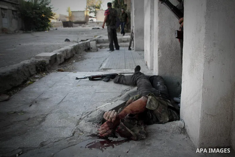 A dead Free Syrian fighter during heavy clashes with Syrian government forces , in the Old Town of Aleppo, September 07, 2012, to retake control of the large Hanano army base in Aleppo. Photo by Ahmed Deeb