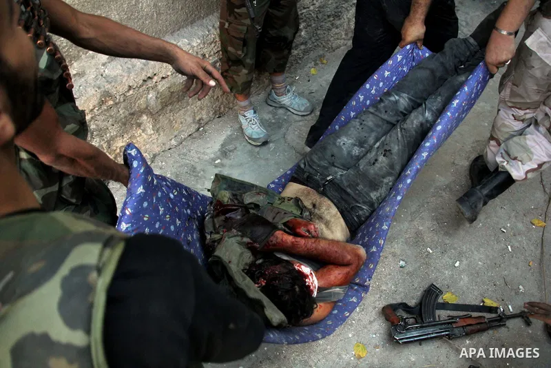 A dead Free Syrian fighter during heavy clashes with Syrian government forces , in the Old Town of Aleppo, September 07, 2012, to retake control of the large Hanano army base in Aleppo. Photo by Ahmed Deeb