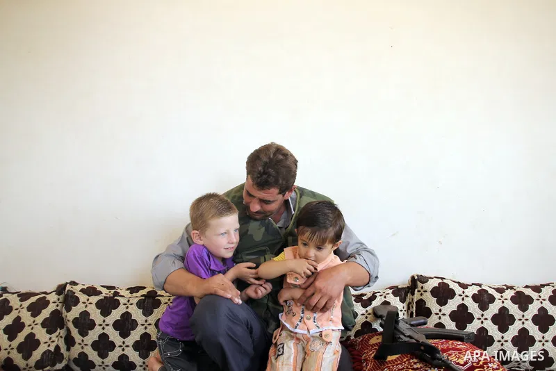 Abu Muhamed, A free Syrian army fighter with his kids before join the FSA Army in the city of Aleppo, September 11, 2012. Photo by Ahmed Deeb
