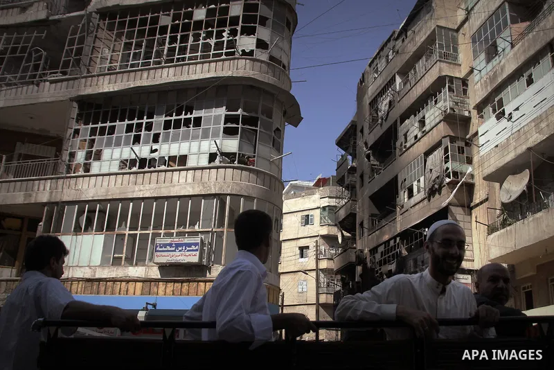 Syrians inspect damages in the old city of Aleppo after the area was shelled by Syrian regime forces on September 12, 2012. Forces loyal to President Bashar al-Assad shelled rebel-held areas across Syria as fierce clashe...