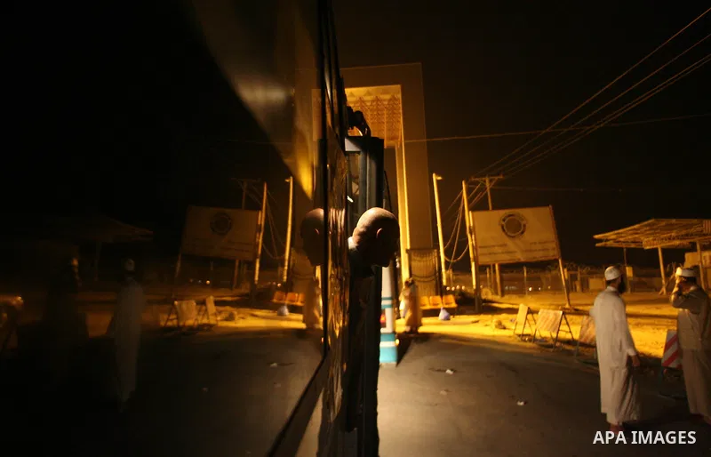 Palestinian pilgrims sit in buses as they wait to cross the Rafah border crossing into Egypt , in the southern Gaza Strip town of Rafah on Oct. 09, 2012 . Hundreds of Palestinian pilgrims crossed into Egypt on their way...