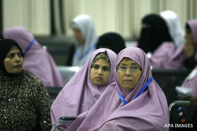 Palestinian pilgrims wait at a hall after they cross the Rafah border crossing into Gaza Strip, in the southern Gaza strip town of Rafah on Oct. 09, 2012. Hundreds of Palestinian pilgrims will cross into Gaza Strip on th...