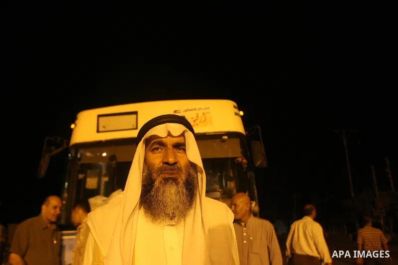 Palestinian pilgrims sit in buses as they wait to cross the Rafah border crossing into Egypt , in the southern Gaza Strip town of Rafah on Oct. 09, 2012 . Hundreds of Palestinian pilgrims crossed into Egypt on their way...