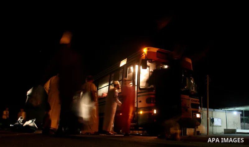 Palestinian pilgrims sit in buses as they wait to cross the Rafah border crossing into Egypt , in the southern Gaza Strip town of Rafah on Oct. 09, 2012 . Hundreds of Palestinian pilgrims crossed into Egypt on their way...