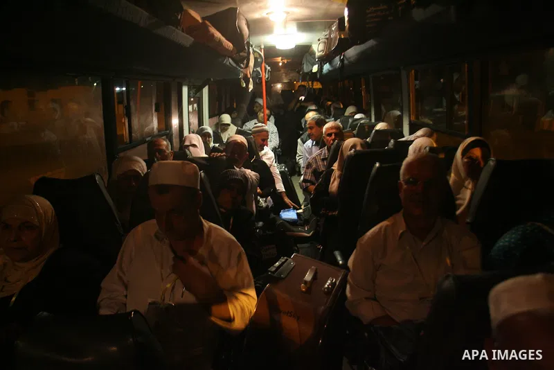 Palestinian pilgrims sit in buses as they wait to cross the Rafah border crossing into Egypt , in the southern Gaza Strip town of Rafah on Oct. 09, 2012 . Hundreds of Palestinian pilgrims crossed into Egypt on their way...
