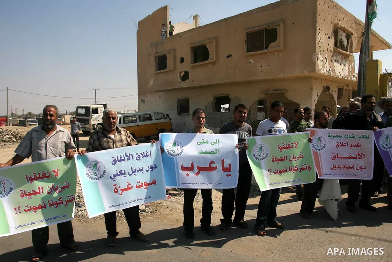 Palestinians participate a protest against Israeli siege imposed on Gaza strip during a rally in Rafah in the southern Gaza Strip, on Oct. 10, 2012. Photo by Eyad Al Baba