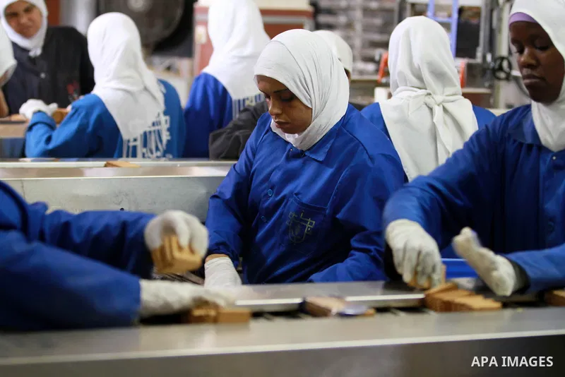 Palestinian workers quality control biscuits at the al-Awda factory in Deir al-Balah, in the central Gaza strip, on October 10, 2012. The World Food Program (WFP) will export the biscuits to United Nation run schools in...