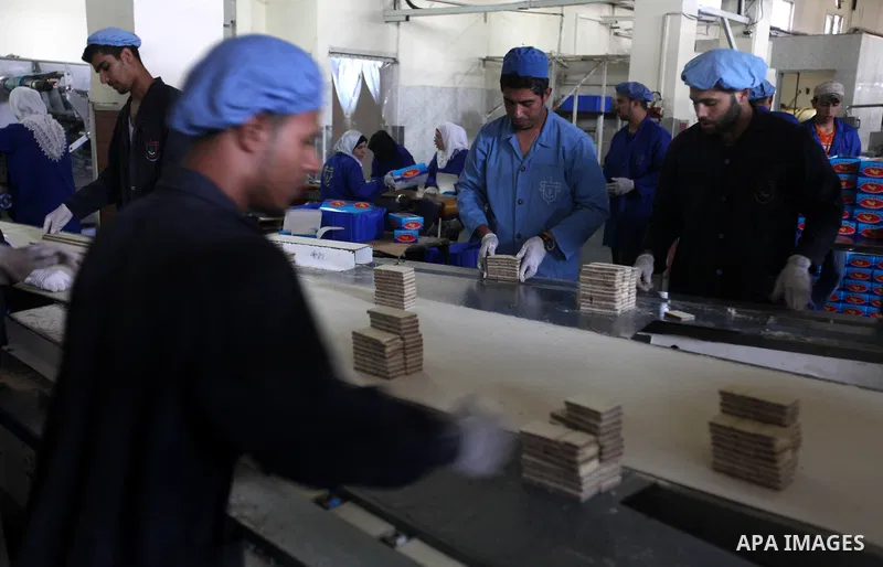Palestinian workers quality control biscuits at the al-Awda factory in Deir al-Balah, in the central Gaza strip, on October 10, 2012. The World Food Program (WFP) will export the biscuits to United Nation run schools in...